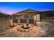 Outdoor firepit with Adirondack chairs and decorative screen on a pergola with fire at 499 Silver Creek Rd, Idaho Springs, CO 80452