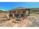 Outdoor firepit with Adirondack chairs and decorative screen on a pergola at 499 Silver Creek Rd, Idaho Springs, CO 80452