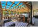 Hot tub on patio under wood pergola with privacy screen and mountain view at 499 Silver Creek Rd, Idaho Springs, CO 80452