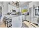 Bright kitchen boasts white cabinets, stainless appliances, quartz counters and mountain views at 499 Silver Creek Rd, Idaho Springs, CO 80452