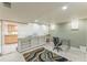 Finished basement featuring custom built-ins, office area, and access to kitchen space at 461 Fillmore St, Denver, CO 80206