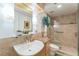 Well-lit bathroom featuring walk-in shower, granite countertop, and modern fixtures at 461 Fillmore St, Denver, CO 80206