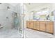 Bathroom features a glass shower, double sinks, and a large, well-lit mirror at 461 Fillmore St, Denver, CO 80206