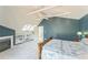 Bedroom boasts vaulted ceilings, fireplace, and built-in shelving for ample storage at 461 Fillmore St, Denver, CO 80206
