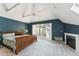 Spacious bedroom featuring a fireplace, large window, and stylish blue accent wall at 461 Fillmore St, Denver, CO 80206