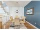 Bright dining room features hardwood floors, modern lighting, and seating for six at 461 Fillmore St, Denver, CO 80206