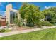 Modern home features a large window and lush landscaping, creating a beautiful curb appeal at 461 Fillmore St, Denver, CO 80206