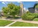 Modern home features a large window and lush landscaping, creating a beautiful curb appeal at 461 Fillmore St, Denver, CO 80206