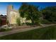Modern home features a large window and lush landscaping, creating a beautiful curb appeal at 461 Fillmore St, Denver, CO 80206