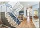 Spacious foyer with modern staircase, hardwood floors, and open layout offer a bright welcoming entrance at 461 Fillmore St, Denver, CO 80206