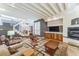 Inviting living room features a fireplace, staircase, and coffered ceiling, creating a relaxing ambiance at 461 Fillmore St, Denver, CO 80206