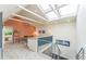 Lofted office space with vaulted ceilings, skylights, and a ceiling fan at 461 Fillmore St, Denver, CO 80206