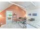 Lofted office area with granite half-wall open to a lower level with bay window seating at 461 Fillmore St, Denver, CO 80206
