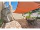 Private outdoor patio featuring tiled floors, spiral staircase and sunshade sail at 461 Fillmore St, Denver, CO 80206
