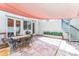Inviting outdoor patio featuring tiled floors, spiral staircase, and dining area with shade sail at 461 Fillmore St, Denver, CO 80206