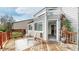 Charming back deck provides an open space to enjoy the outdoors, with access to inside, and a pet door at 5308 S Ukraine St, Aurora, CO 80015