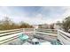 Balcony with turquoise chairs and a small table provides a pleasant outdoor space with neighborhood views at 5308 S Ukraine St, Aurora, CO 80015