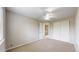 Comfortable bedroom featuring carpeting, closet, and a ceiling fan, complemented by natural light at 5308 S Ukraine St, Aurora, CO 80015