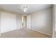 Spacious bedroom with carpet, closet and ensuite door at 5308 S Ukraine St, Aurora, CO 80015
