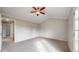 This bedroom features vaulted ceiling, ceiling fan, and multiple doorways adding architectural detail and functionality at 5308 S Ukraine St, Aurora, CO 80015