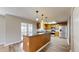Bright kitchen boasts wood cabinets, stainless steel appliances, granite countertops, and a functional island at 5308 S Ukraine St, Aurora, CO 80015