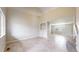 Spacious living room with neutral walls and tile flooring, open layout for easy entertaining at 5308 S Ukraine St, Aurora, CO 80015