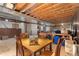 Unfinished basement featuring exposed beams and a table with chairs, ready for customization at 16478 Marion St, Thornton, CO 80602