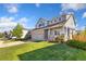 Charming two-story home with a well-manicured lawn and a two-car garage at 16478 Marion St, Thornton, CO 80602