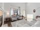 Inviting living room featuring a fireplace and ample natural light at 16478 Marion St, Thornton, CO 80602
