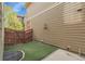 The backyard features a side yard with synthetic grass and durable composite siding at 368 Dallas St, Denver, CO 80230