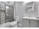 Updated bathroom with walk in shower and modern vanity with stylish fixtures at 368 Dallas St, Denver, CO 80230