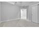 Spacious room with neutral carpet and paint, complemented by abundant natural light at 368 Dallas St, Denver, CO 80230