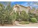 Side view of home featuring manicured shrubbery, trees and steps leading to the entrance at 368 Dallas St, Denver, CO 80230