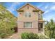 Charming two-story home featuring a brick facade and well-maintained landscaping, creating curb appeal at 368 Dallas St, Denver, CO 80230