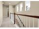 Upper level hallway featuring natural light and wood and white banister at 368 Dallas St, Denver, CO 80230