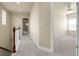 Bright hallway leading to a spacious, sunny bedroom with a ceiling fan at 368 Dallas St, Denver, CO 80230