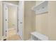 Bright mudroom area featuring coat hooks, shelving, and a convenient bench seat at 368 Dallas St, Denver, CO 80230