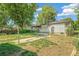 Wide view of the home's backyard showing the patio, yard and clothes line at 5008 Alcott St, Denver, CO 80221
