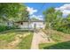 Backyard featuring a covered patio and spacious yard at 5008 Alcott St, Denver, CO 80221
