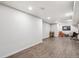 Spacious basement area with bright lighting and open layout for versatile use at 5008 Alcott St, Denver, CO 80221