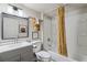 Modern bathroom with updated vanity, bathtub and shower combination, and stylish decor at 5008 Alcott St, Denver, CO 80221