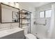 Updated bathroom boasts a modern vanity, updated fixtures, and walk-in shower with grab bar at 5008 Alcott St, Denver, CO 80221