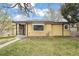 Cozy home featuring well-kept lawn and inviting exterior; great curb appeal at 5008 Alcott St, Denver, CO 80221