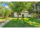 Charming home with landscaped front yard and prominent 'For Sale' sign at 5008 Alcott St, Denver, CO 80221