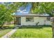 Charming single-story home with a well-maintained front yard and stone accents at 5008 Alcott St, Denver, CO 80221