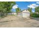 Detached garage and driveway located behind the home at 5008 Alcott St, Denver, CO 80221