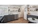 Well-equipped kitchen featuring sleek countertops, gray cabinets, and modern stainless steel appliances at 5008 Alcott St, Denver, CO 80221
