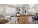 Bright living room with hardwood floors and large window allows for lots of natural light at 5008 Alcott St, Denver, CO 80221