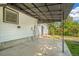 Covered patio with metal awning attached to the home at 5008 Alcott St, Denver, CO 80221