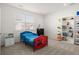 Bright bedroom for a with a bed featuring Spiderman theming, a view to a window, and shelving for toys at 5861 Tesoro Pt, Parker, CO 80134